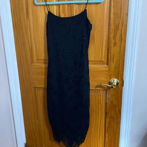 Sparkly spaghetti, strap, long fitted dress.